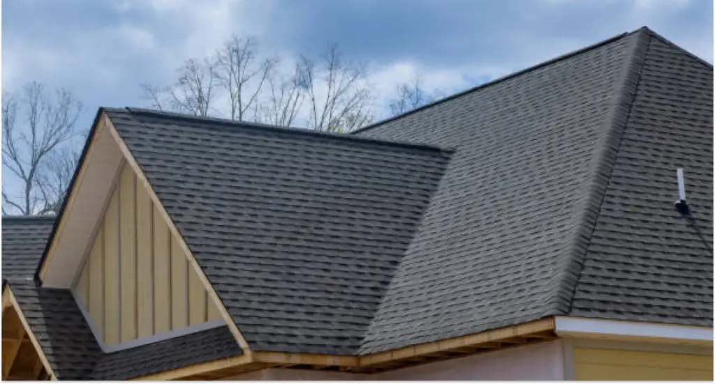 Residential roof repair on a steeply pitched roof, restoring structural integrity and visual appeal for a home in Queensland.